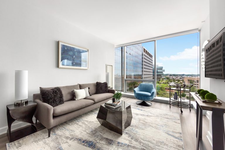Living room with floor-to-ceiling windows.